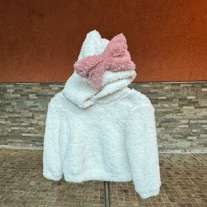 White fluffy sweater with bow